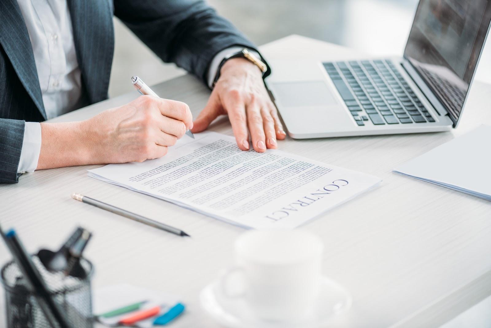 Businesswoman signing a contract